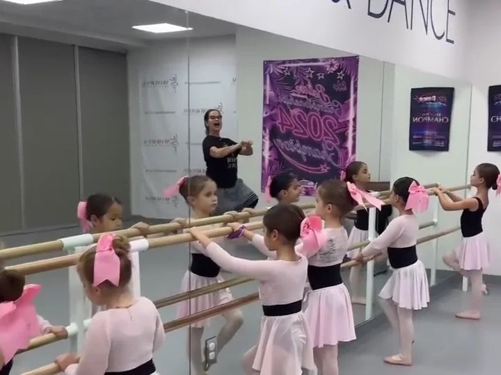 Young Early Ballet students receiving guided barre instruction at Miami Royal Ballet in Coral Gables
