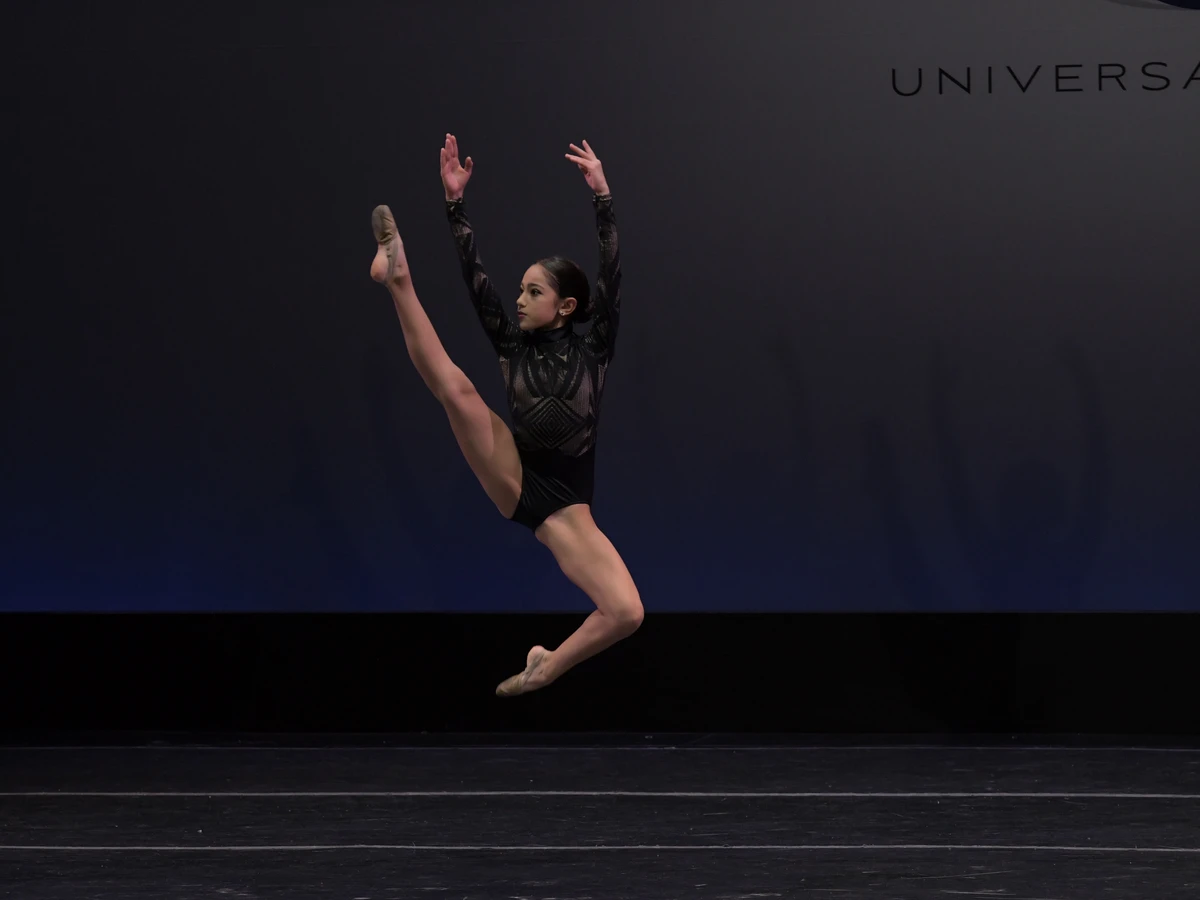 Miami Royal Ballet Jazz dancer performing a dynamic competition leap on stage
